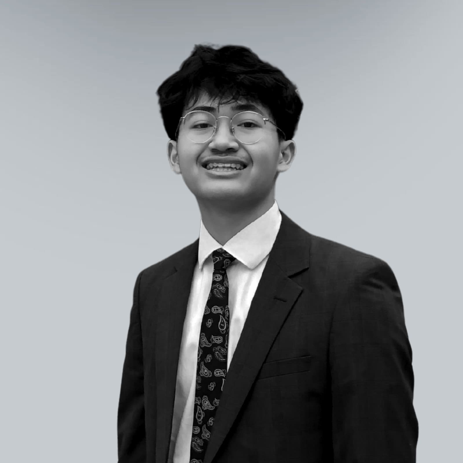 Studio portrait of Ihsan Tjahyono in a suit