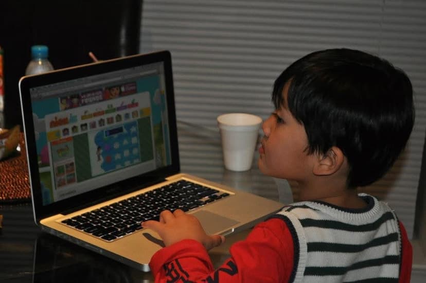 Ihsan Tjahyono as a child at a laptop
